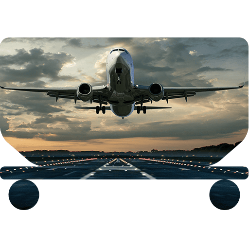Airplane takes off at sunset on runway.