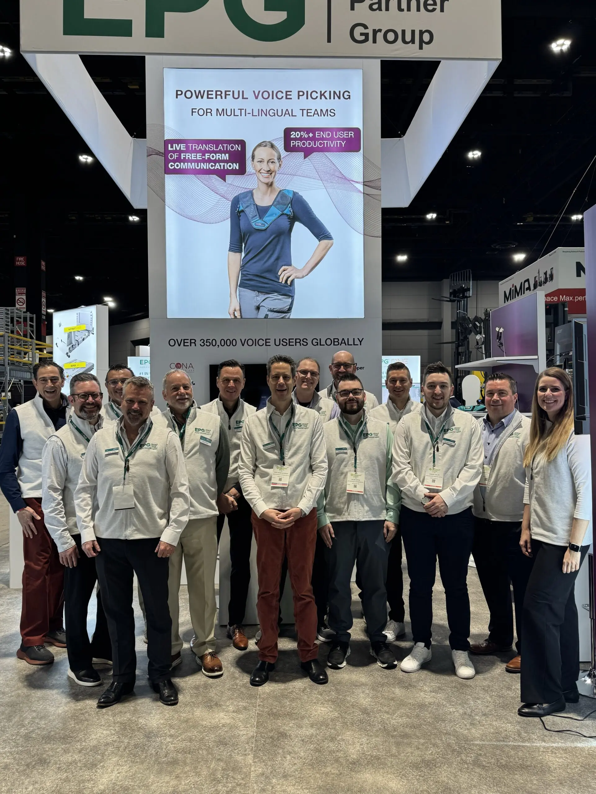 Team at booth showcasing voice technology solutions.