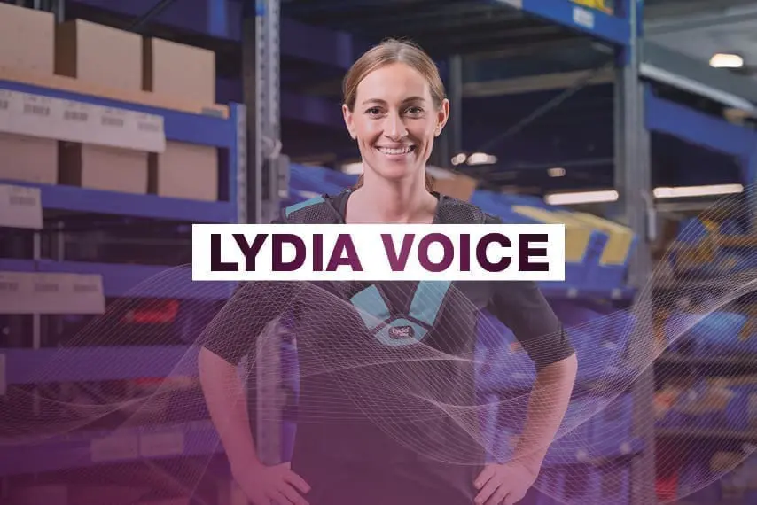 Woman smiling in warehouse with Lydia Voice label.