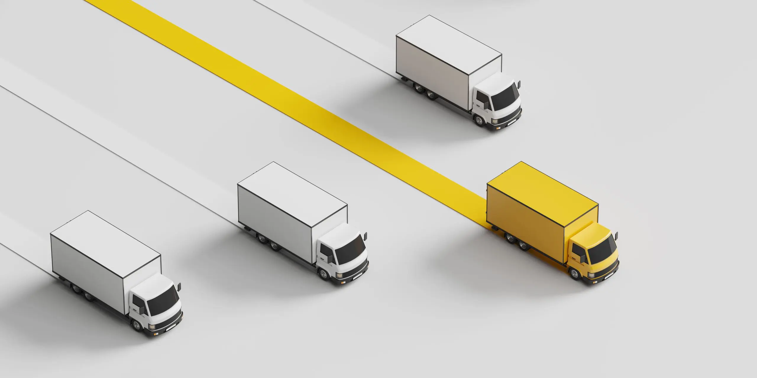 Yellow truck leading white trucks on highway