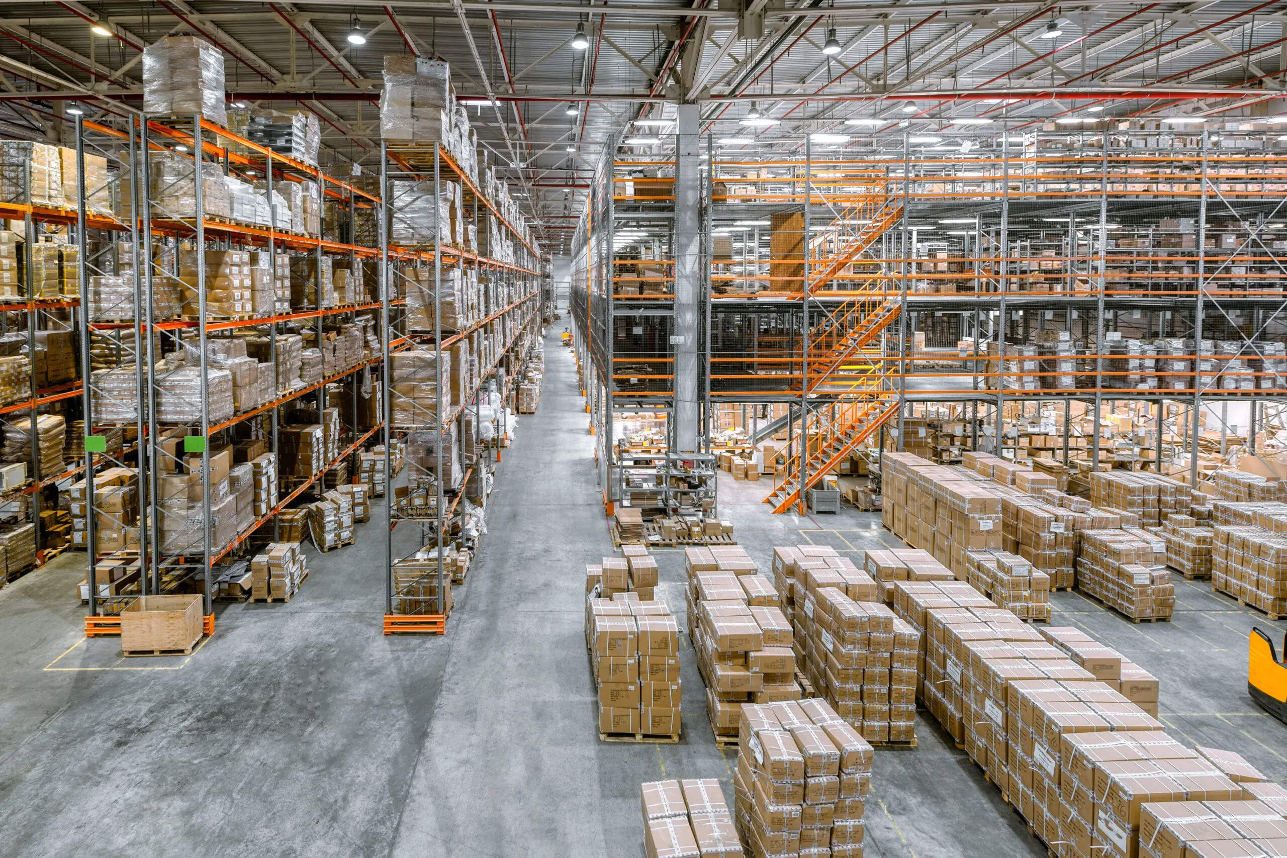 Large warehouse with stacked boxes and shelves