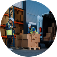 Workers loading boxes into delivery van.