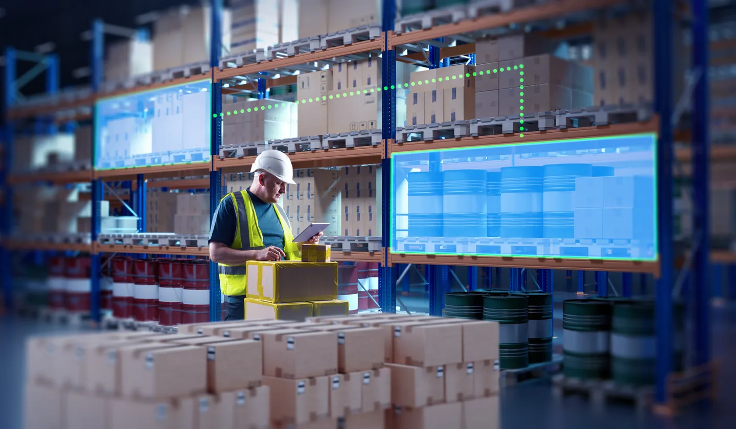 Warehouse worker using tablet with augmented reality inventory display