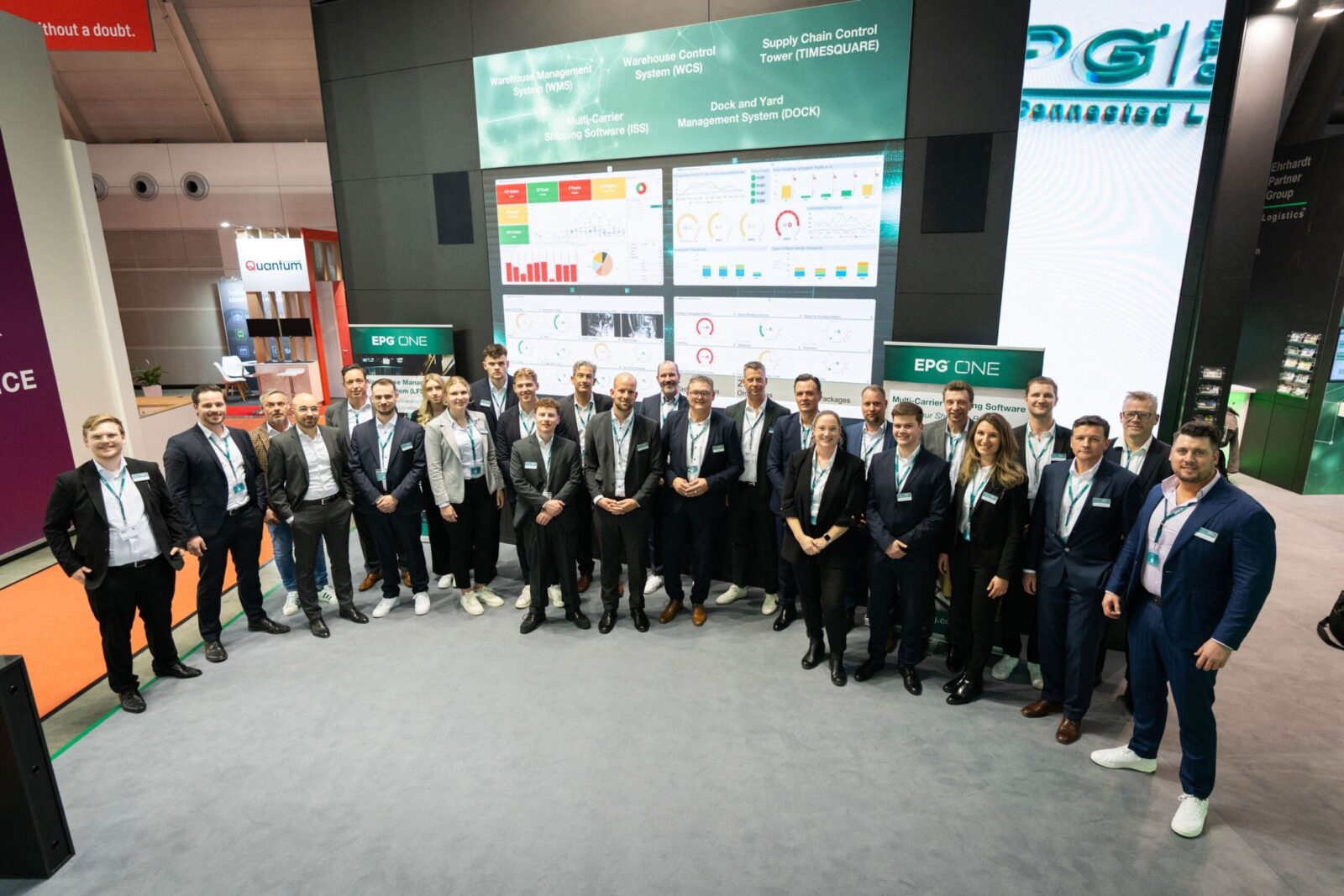 Group at tech conference with digital displays