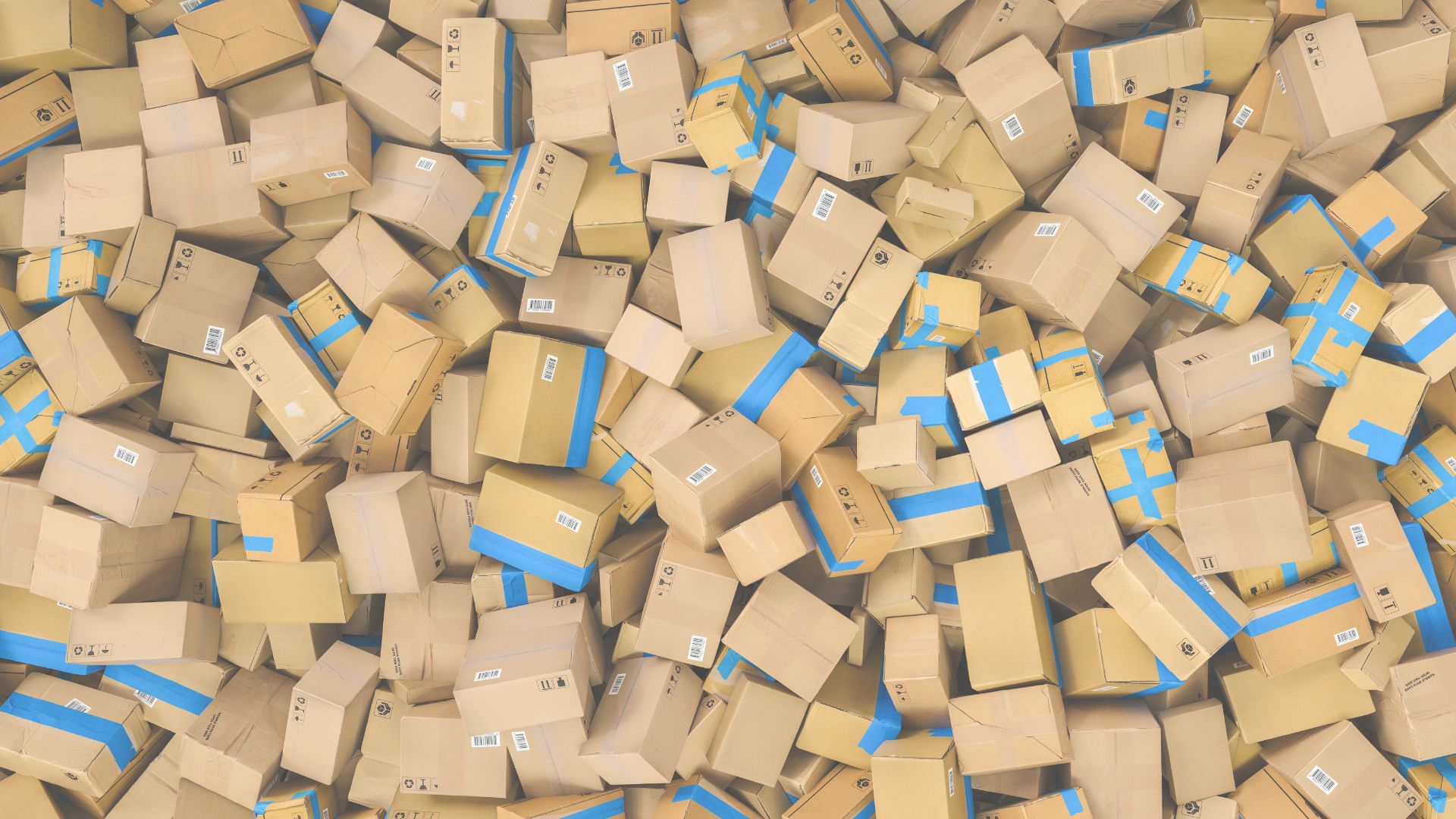 Pile of cardboard boxes with blue tape