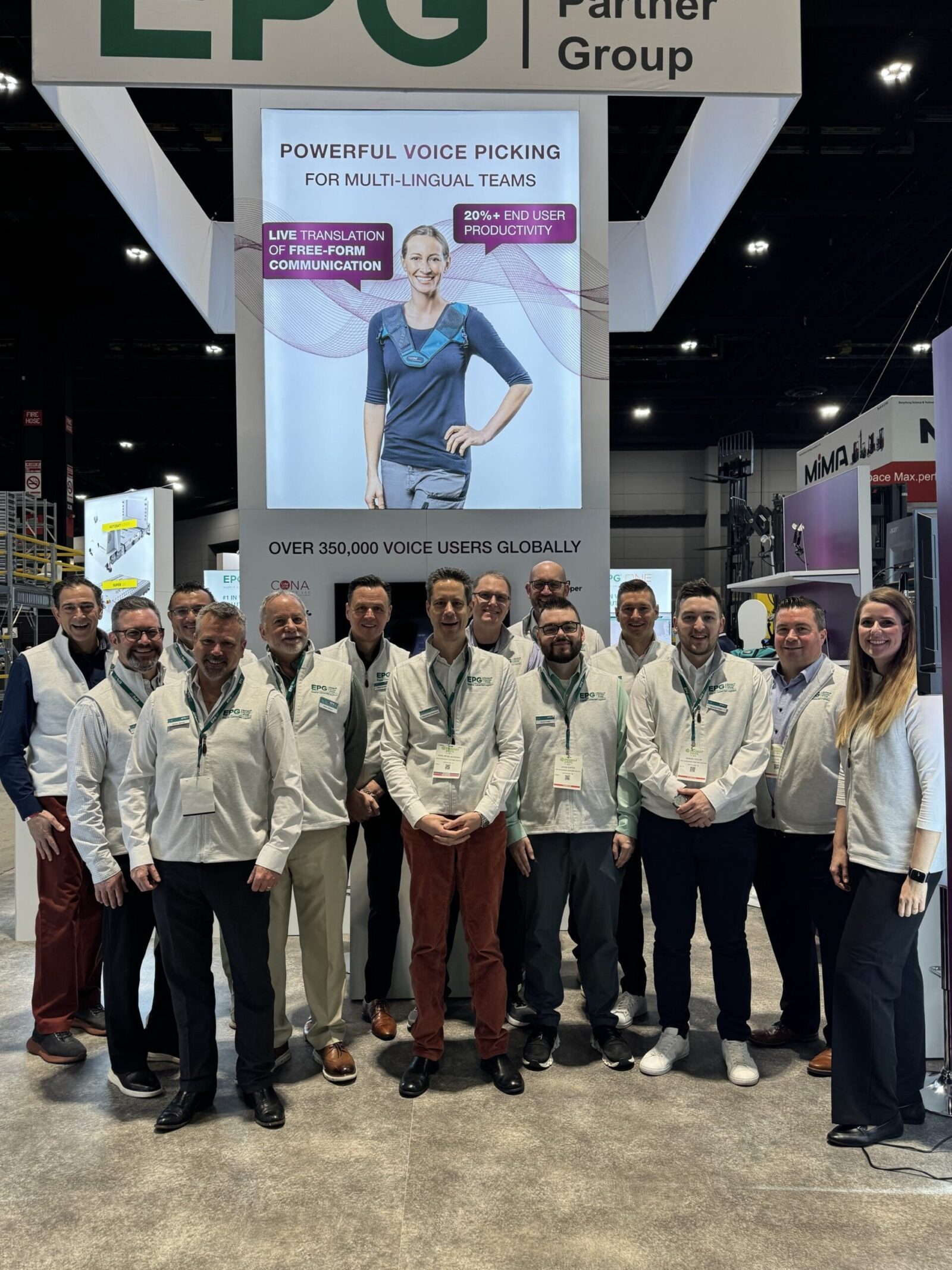 Team at booth showcasing voice technology solutions.