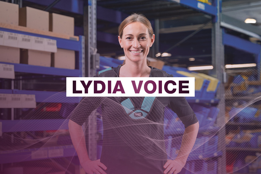 Woman smiling in warehouse with Lydia Voice label.