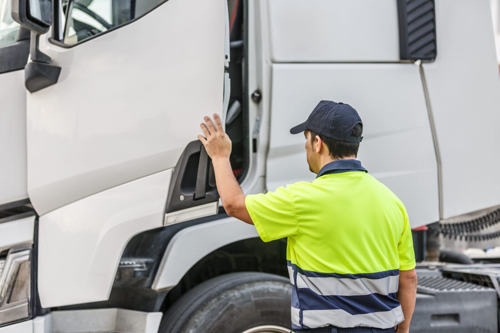Truck driver opening vehicle door