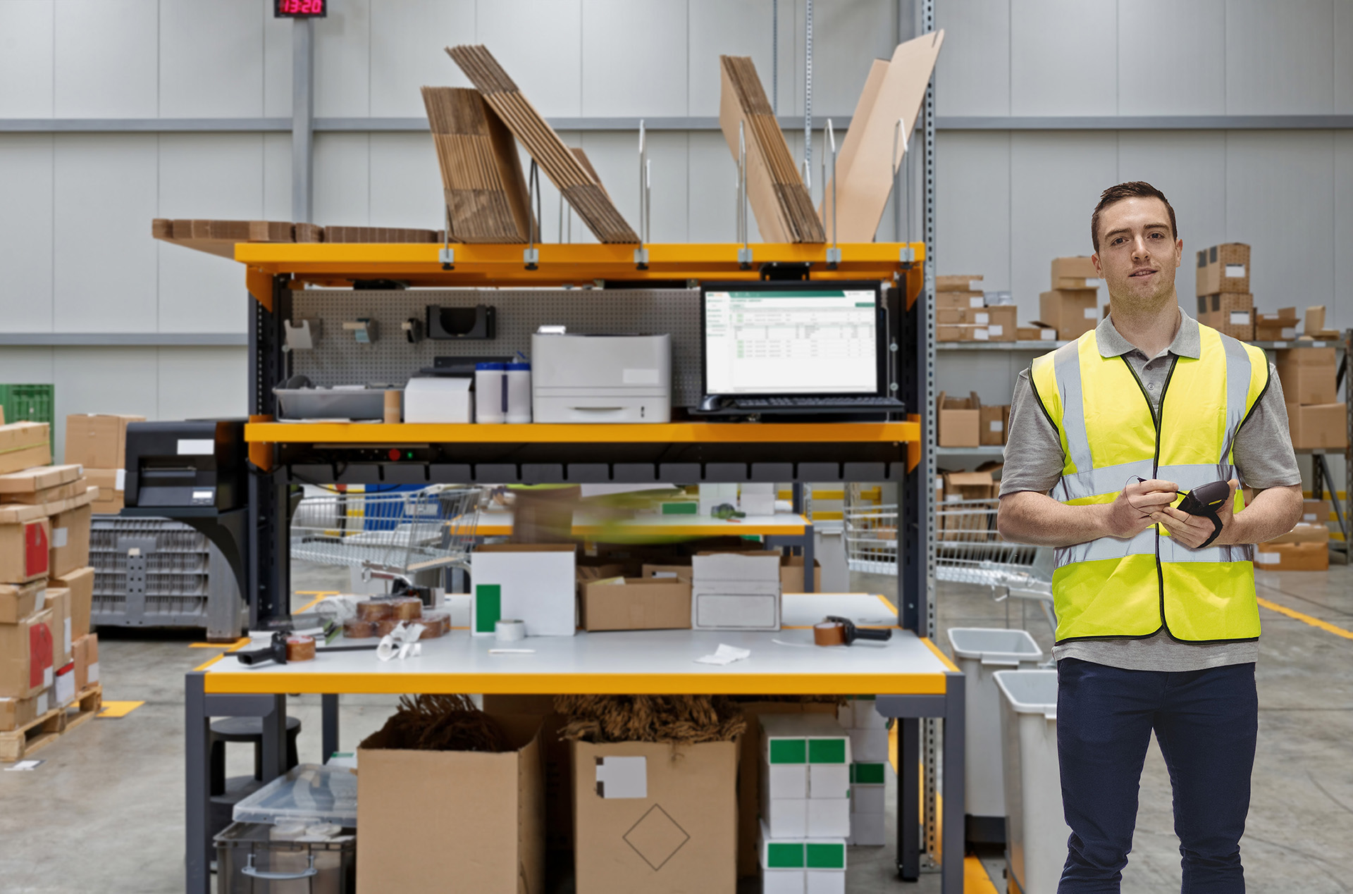 Warehouse worker in safety vest with clipboard