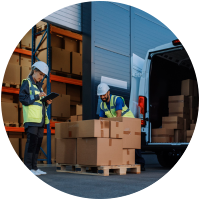 Workers loading boxes into delivery van.