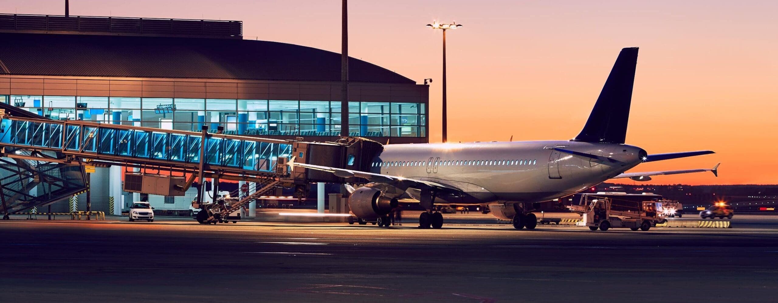 Airplane at airport during sunset