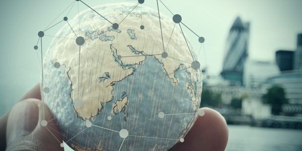 close up of businessman hand showing texture the world with digital social media network diagram concept Elements of this image furnished by NASA london city background